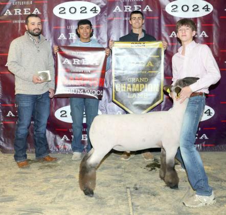 Kooper Edwards of Sudan FFA won Grand Champion Lamb at the Littlefield Area Junior Livestock Show on Friday at the Lamb County Ag Center. Shown with Judge Walker Hemphill. (Photo by MD Creations)