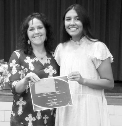 Lamb County NRCS District Conservationist Brenda May awards Springlake-Earth High School’s Senior Essay Contest second-place winner, Hannah Alvarez, with a certificate and a $75 prize. (Submitted Photo)