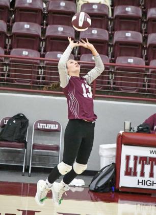 Littlefield freshman, Maggie McNeese, tips a ball over the net, looking to catch the Childress defense off guard, during the first set of their match with Childress on Saturday, at Wildcat Gym. (Staff Photo by Derek Lopez)