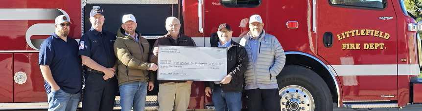 CONTINENTAL/SELECT MILK, represented by Steve Cooper, was in attendance for the check presentation at the Littlefield Fire Department for the Dedication of the New Quint Fire Truck. Continental/Select Milk contributed $75,000. Shown is Cooper with Littlefield Fire Chief Jaime Grey, Mayor Eric Turpen, City Manager Mitch Grant and Council Members Eric Saenz and Buddy Holmes. (Staff Photo by Derek Lopez)