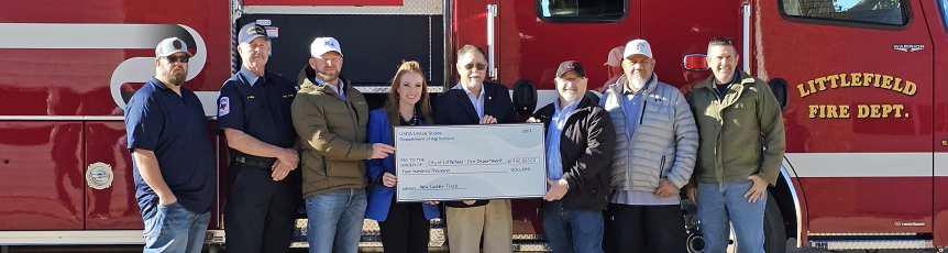 USDA, represented by USDA Regional Director, Clyde Jenkins and State Office Program Specialist, Kendra Burson, attend the check presentation at the Littlefield Fire Department for the Dedication of the New Quint Fire Truck. USDA contributed $400,000 ($200K Community Facilities and $200K PP). Shown are Jenkins and Burson with Littlefield Fire Chief Jaime Grey, Mayor Eric Turpen, City Manager Mitch Grant and Council Members Eric Saenz, Buddy Holmes and Kenny Rucker. (Staff Photo by Derek Lopez)