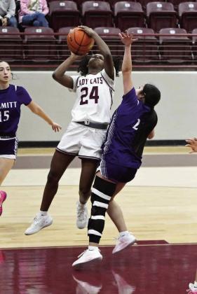 Littlefield sophomore, Amoni Jefferson ( 24), finished a lay-up through contact, during the first half of the Lady Cat’s district victory over Dimmitt at Wildcat Gym on Tuesday. (Staff Photo by Derek Lopez)