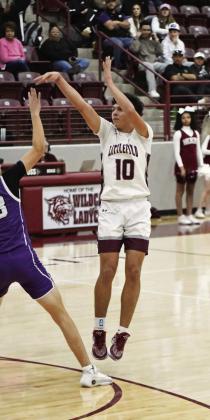 Littlefield senior, Nate Castaneda (10), buries a three from the top of the key, during the first half of the Wildcats’ district victory over Dimmitt on Tuesday at Wildcat Gym. (Staff Photo by Derek Lopez)