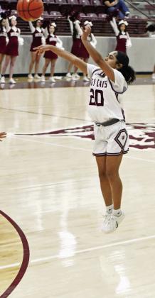 Littlefield sophomore, Aubree Richardson (20), fires up a three from the left elbow, during the first half of the Lady Cat’s district victory over Dimmitt at Wildcat Gym on Tuesday. (Staff Photo by Derek Lopez)