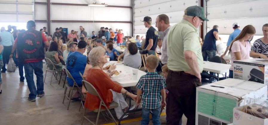 A LARGE CROWD attended the benefit for Sgt Shawn Wilson. Participants enjoyed freshly grilled hamburgers, a silent auction and great fellowship. (Photo by Ann Reagan)