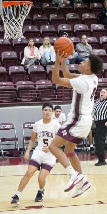 Littlefield’s Kam McCarty (4), finishes at the rim with a floater in transition, during the second half of the WIldcats’, 63-55, home victory to close out the pre-district schedule on Saturday. (Staff Photo by Derek Lopez)