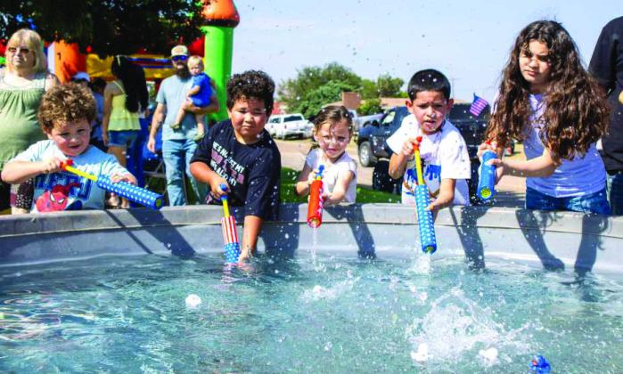 Children compete in duck races at the annual Amherst celebration on July 25, 2026. (Photo by Madison Vidales)