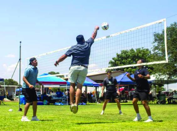 Several individuals play volleyball at the annual Amherst celebration on July 25, 2026. (Photo by Madison Vidales)