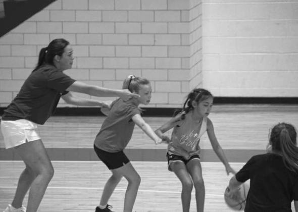 Coach Sasha Bridges signals instructions during a scrimmage at the Olton Fillie Basketball Camp on June 2. (Photo by Leon Szaniszlo)