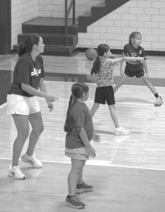 Coach Sasha Bridges Instructs campers during a scrimmage game at the Olton Fillie Basketball Camp on June 2. (Photo by Leon Szaniszlo)