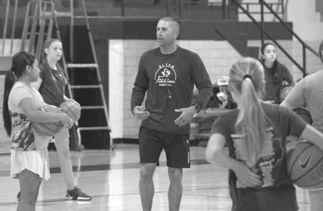 Head Coach Jay Gorman gives instructions to campers during a scrimmage at the Olton Fillie Basketball Camp on June 2 at Olton Gymnasium. (Photo by Leon Szaniszlo)