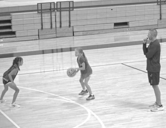 During a scrimmage at the Olton Fillie Basketball Camp on June 2, Head Coach Jay Gorman oversees campers at Olton Gymnasium. (Photo by Leon Szaniszlo)