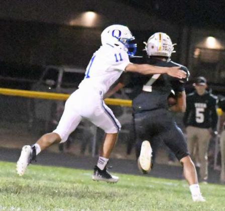 WRAPPING UP - Olton linebacker, Jason Granillo (11), makes a tackle on Vega’s Joaquin Segovia, during the second half of the Mustangs, 21-13, loss to the Longhorns on Friday to close out predistrict play. (Staff Photo by Derek Lopez)
