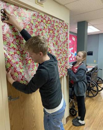 Members of Littlefield 4-H decorated the doors at Lamb Healthcare Center, as part of their Service Project on December 10th.