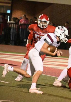PUNCHING IT IN FOR THE SCORE – Littlefield sophomore quarterback, Chip Green (12), keeps it himself on a short touchdown run late in the second half of the Wildcats’, 33-14, victory over Denver City on the road on Friday night. (Staff Photo by Derek Lopez)