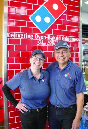 Supervisor Jessa and facilities director Johnny Busby celebrate the opening of the first Domino's location in Littlefield on Feb. 6, 2026. (Photo by Madison Vidales)
