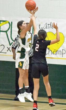 MID-RANGE SHOOTING – Springlake-Earth’s Emma Samaron (25), knocks down a mid-range jumper from the left wing over the Lockney defense, during the second half of the Lady Wolverine’s loss to the Lady Horns on Tuesday during their season-opener. (Staff photo by Derek Lopez)