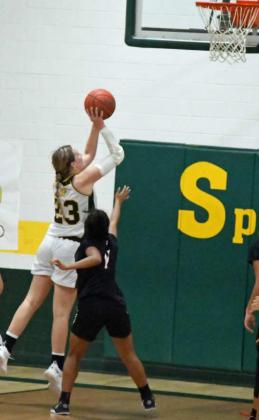 GETTING TO THE BUCKET – Springlake-Earth senior, Sayler Beerwinkle (23), gets to the bucket for a lay-up, during the second half of the Lady Wolverine’s loss to the Lady Horns on Tuesday during their season-opener. (Staff photo by Derek Lopez)