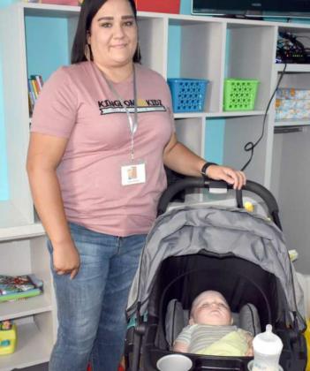 KINGDOM KIDZ’ INFANT CLASS—Angel Saldana, teacher of the infant class at First Baptist Church’s Kingdom Kidz ‘Parents Day Out”, watches Everett Davis who was sleeping peacefully. (Photo by Krista Carpenter)