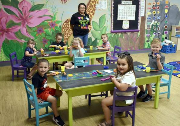 MRS. KORTNEY’S 4- AND 5-YEAR OLD CLASS –With plenty of social distancing space between the students in the 4-and5-year-old Kindgon Kidz Class for Parents dayOut, are these youngsters in Mrs. Korney’s Class. They were enjoying working with playdough and cookie cuttters, and showing big smiles. They are Gage Gonzalez, Beau Wright, Frankie Martin, Jace Lopez, Abigail Davis, Kyndel Foley, and Lincoln Griffith. (Photo by Krista Carpenter)