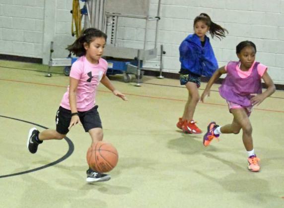 PICK-UP GAME – Lady Cat Basketball summer campers enjoyed a pick-up game to close out the second day of the Littlefield Lady Cat Summer Basketball Camp on Tuesday, during the morning session of the camp. (Staff Photo by Derek Lopez)