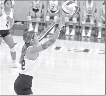 Littlefield’s Mattie Seymore pushes a ball over the net, during the first set of the Lady Cat’s, 0-3, loss to Idalou on Tuesday in their district-opener at Wildcat Gym. (Staff Photo by Derek Lopez)