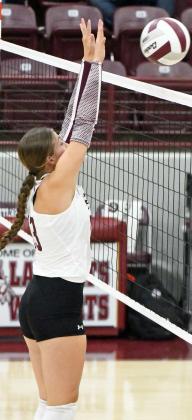 Littlefield’s Maggie McNeese deliveres a block late in the first set of the Lady Cat’s, 0-3, loss to Idalou on Tuesday in their district-opener at Wildcat Gym. (Staff Photo by Derek Lopez)