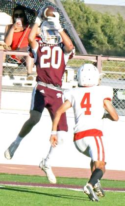 Littlefield Maroon wide receiver, Gabe Mata, goes up and makes a big catch on the visitor’s sideline, taking the ball deep into Coahoma territory, during their, 44-6, victory on Thursday at Wildcat Stadium. (Staff Photo by Derek Lopez)