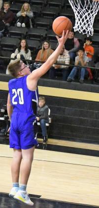 CLOSING OUT STRONG – Amherst sophomore, Gabriel Garcia, picks up a steal and sprints down the court, dropping in a lay-up to close out the first quarter for the Bulldogs in their 1A Region I Bi-district match-up against the Texline Tornadoes. (Staff Photo by Derek Lopez)
