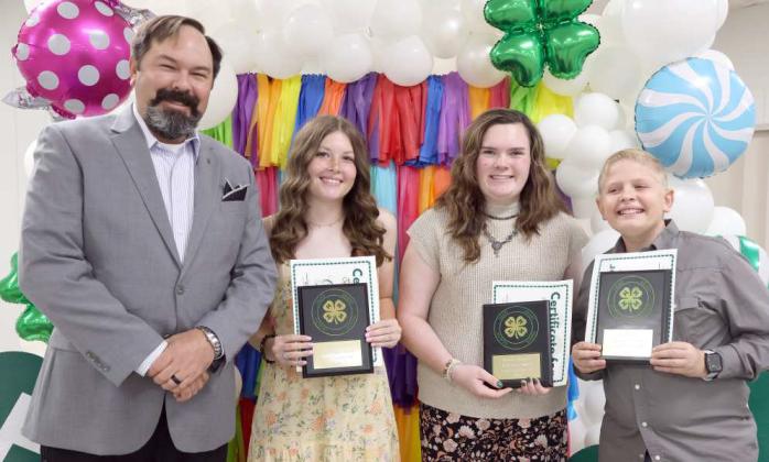 Blake Moore, LCEC CEO, awarded he Lighthouse Awards sponsored by Lamb County Electric Co-op to Garieyn Bigham, Valerie Harper, and Jack Reese during the 2023-2024 4-H Banquet held on Saturday, August 17, 2024. (Photo by Ann Reagan)