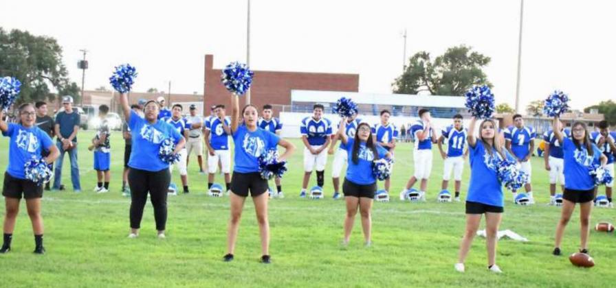 The Amherst varsity cheer squad fires up the crowd during Meet The Bulldogs on Friday after Amherst’s scrimmage with Whiteface at Bulldog Stadium. (Staff Photo by Derek Lopez)