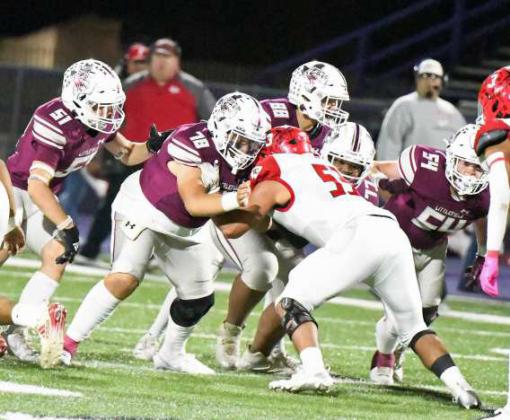 Littlefield senior center, Sean Ybarra (78), secures a block in the middle, during the Wildcat’s Bi-district victory over Friona in Clovis, N.M. on Friday in the Class 3A Football Play-offs. (Staff Photo by Derek Lopez)
