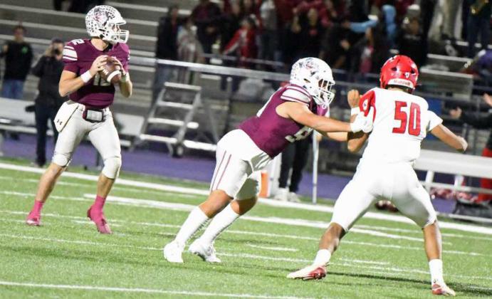 Littlefield senior tackle, Marcquis Rosemond (50) keeps his block on a Friona defender giving his quarterback time to look for an open receiver, during the Wildcat’s Bi-district victory over Friona in Clovis, N.M. on Friday in the Class 3A Football Play-offs. (Staff Photo by Derek Lopez)