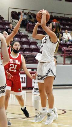 STOP-AND-POP—Littlefield senior, Geyah Garza (23), pulls up for a jumper from the left elbow over the Friona defense, during the Lady Cats’ blowout win over the Squaws on Tuesday at Wildcat Gym. (Staff Photo by Derek Lopez)