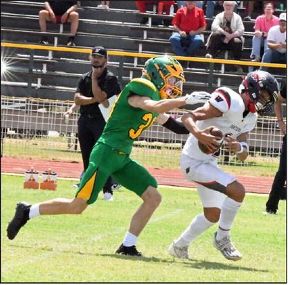 Springlake-Earth’s Levi Hill (30), chases down Whitharral’s Damian Rodriguez in the backfield for a huge sack, during the Wolverine’s loss to the Panthers on Saturday in their season-opener. (Staff Photo by Derek Lopez)