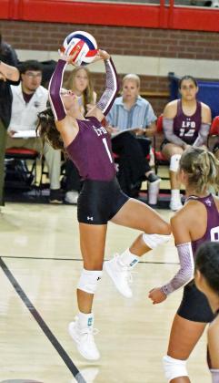Littlefield junior, Bryndle Ray, sets a ball up in the air, as the Lady Cats look to go on the attack, during the first set of their match against the Fillies in Denver City on Tuesday. (Staff Photo by Derek Lopez)