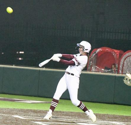 Littlefield sophomore, Maggie McNeese, blasts a three-run homerun to left-center field, as part of an eight-run bottom of the second inning, during the Lady Cats, 13-12, victory over Brownfield in their home-opener on Tuesday at Lady Cat Field. (Staff Photo by Derek Lopez)