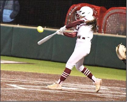 Littlefield’s two-hole hitter, Alyssa Torres, ripped a triple to center field to give the Lady Cats a base runner in the bottom of the first inning, during the Lady Cats, 13-12, victory in their season-opener on Tuesday. (Staff Photo by Derek Lopez)