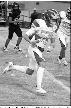 Springlake-Earth’s Levi Hill (30), breaks loose for a touchdown run, during the first half of the Wolverine’s road loss to Wellman-Union last Friday. (Staff Photo by Derek Lopez)