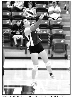 Olton’s HalleeKate Huguley sents a ball back over the net, during the first set of the Fillies loss to Abernathy last Tuesday. (Staff Photo by Derek Lopez)