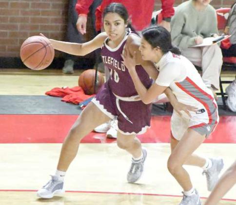 Littlefield’s Nevaeh Esquibel drive the right side, looking to make a play, during the first half of the Lady Cats’, 47-41, victory over the Denver City Fillies to open district play on Tuesday. (Staff Photo by Derek Lopez)