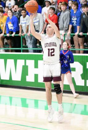 Littlefield junior, Chip Green, drains a three from the left wing, during the second half of the Wildcats’ Area Championship game against Childress on Friday at Floydada High School to put him over 1,000 career points. He finished his junior year with a career mark of 1,003 points. (Staff Photo by Derek Lopez)