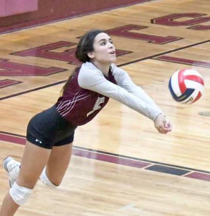KEEPING THE PLAY ALIVE - Littlefield senior, Abigail Ybarbo, hustles to keep a play alive, sending the ball back over the net, during set two, of the Lady Cats’ Bi-district play-off game against Bushland on Tuesday at Tulia. (Staff Photo by Derek Lopez)