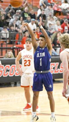 Olton’s Sebastian Sparkman knocks down a pair of free throws to ice the game for the Mustang’s in overtime, as they take the Class 2A-DI Area Championship over West Texas, 53-45, at Tascosa High SChool on Friday night. (Staff Photo by Derek Lopez)