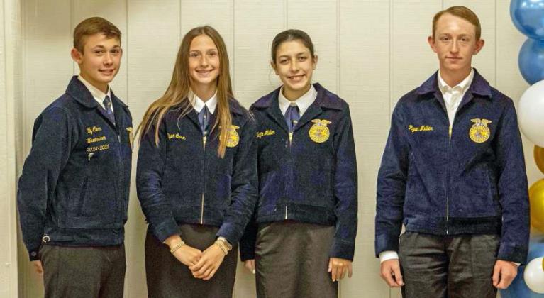 Ty Carr, Tayte Miller, Piper Carr and Ryan Muller pose to receive recognition for participating in the Livestock Career Development Event at the annual FFA banquet on May 12, 2025. (Staff Photo by Madison Vidales)