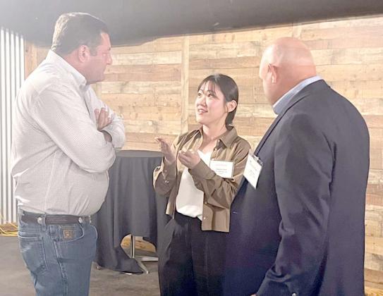 PCG CHAIRMAN BRENT NELSON and Secretary/Treasurer Brent Coker discuss Texas High Plains cotton production with Joanne Park, assistant manager for Kyungbang Ltd., a textile mill in Korea. This particular mill’s cotton consumption is around 165,000 bales, 30% of which come from the U.S. (Photo Courtesy Plains Cotton Growers)