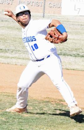 Olton sophomore, Fabian Gutierrez, charges and fields a ground ball in the grass at shortstop and throws it to first for an out, during the Mustangs district-opening win over the Hale Center Owls on Monday, 10-8. (Staff Photo by Derek Lopez)
