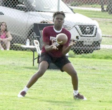 A Littlefield receiver catches a pass from quarterback Sammy Saenz and turns it up field for a decent gain, during the Wildcats’ 7v7 match with Sundown on Monday evening in Littlefield. (Staff Photo by Derek Lopez)