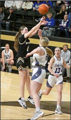PULLING UP IN THE LANE - Sudan senior, Stevi Lockhart (2), pulls up for a jumper in the lane over the Stratford defender, during the second quarter of the Nettes’ Area round loss to the Lady Elks in Vega on Friday night. (Staff Photo by Derek Lopez)