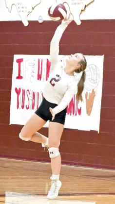 Senior, Kennadi Hanlin, deliveres a serve, during set two, of the Lady Cats, 3-2, victory over Tulia on Tuesday night in district action. (Staff Photo by Derek Lopez)